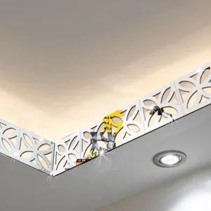 Detailed view of hollow mirror ceiling corner decorative sticker, modern minimalist interior trim.