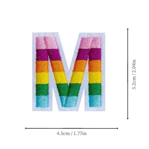 Rainbow embroidered letter M patch, colorful fabric applique for clothing and DIY decor.