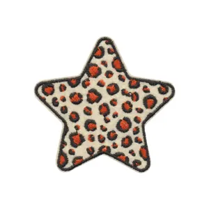 Leopard print star embroidered patch close up, detailed fabric accessory for clothing.