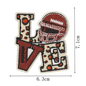Detailed view of football helmet and leopard love embroidery patch for garments decoration.