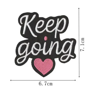 Inspirational quote embroidered patch featuring Keep going text and pink heart design.