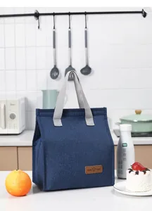 Detailed view of blue oxford cloth insulated lunch bag with comfortable handle and thermal lining.