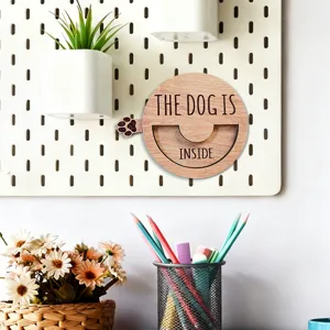 Wooden rotating dog status reminder sign detail, pet door accessory, home decor display.