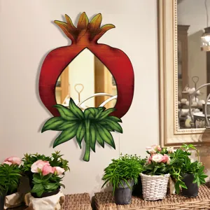 Bohemian pomegranate wooden wall mirror detail, unique fruit shaped home decor accent piece.