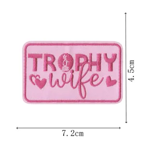 Pink embroidered patch with trophy wife letter design, cute clothing badge for DIY decor.