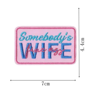 Cute pink embroidered patch with funny slogan lettering, perfect for DIY clothing decor.