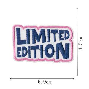 Close up detail view of embroidered limited edition patch with pink and white border.