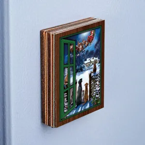 Close-up detail shot of a Christmas wooden fake window fridge magnet featuring a festive snow scene.