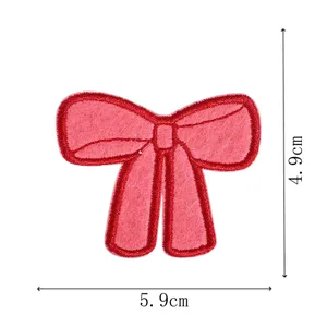 Red bow embroidery patch detail view, showing fine stitching texture and clear dimensions.
