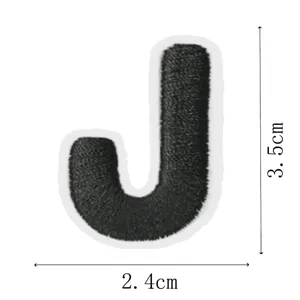 Black embroidered letter J patch detail showing high-density stitching and clear size.