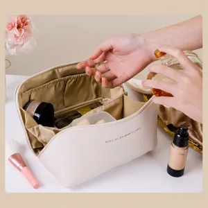 Large capacity portable pillow cosmetic bag, multi-compartment travel makeup storage organizer.