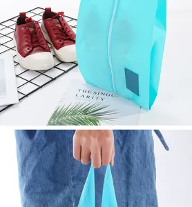 Travel shoe storage bag detail view, blue waterproof oxford fabric portable sneaker organizer.