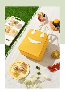 Gele canvas lunchtas met glimlach ontwerp, draagbare bento box tas voor school, kantoor en picknick.