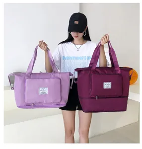 Foldable large capacity travel gym bag with dual handles and front pocket storage.