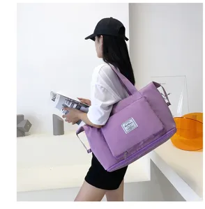 Purple travel gym duffel bag with wet dry separation for short trips and daily fitness use.