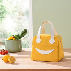 Gele geïsoleerde lunchtas met schattige glimlach, draagbare oxford stoffen bento tas voor studenten