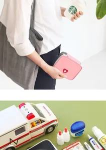 Detailed view of the pink first aid pouch showing compact size and neat zipper structure.