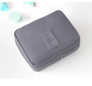 Grey portable travel storage bag cosmetic pouch waterproof wash bag with dual zippers.