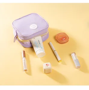 Portable purple mesh cosmetic bag lightweight travel makeup pouch zipper wash bag for daily use.