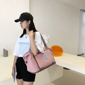 Main view of a stylish pink travel duffel bag for short trips, fitness, and daily storage.