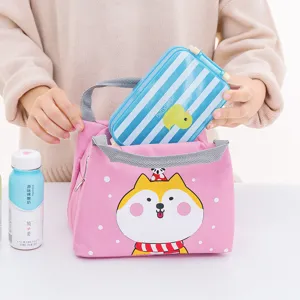 Pink insulated lunch bag with cute cartoon dog design, portable thermal tote for school and work.