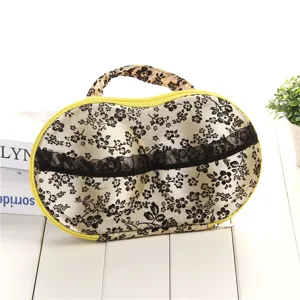 Detailed view of portable EVA bra storage organizer bag with floral pattern and handle.