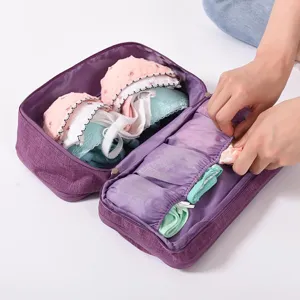 Portable travel underwear storage bag with multiple compartments for bras and panties neatly.