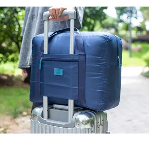 Opvouwbare reistas grote capaciteit bagagetas voor kleding en schoenen reIS detail weergave.