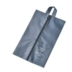 Portable travel shoe bag waterproof folding organizer with zipper handle grey color storage.