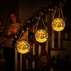 LED glowing Christmas hanging sign detail with cute highland cow in festive interior view.