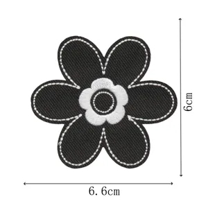 Detailed view of black embroidered flower patch, perfect for DIY clothing and bags decoration.