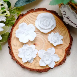 Close up detail of white 3D printed flower fridge magnets, exquisite floral decor, magnetic.