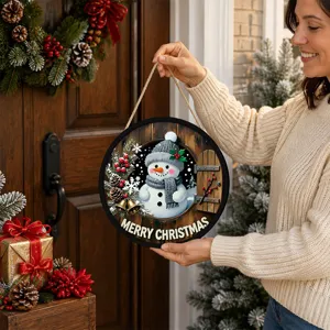 Detail view of Christmas wooden hanging sign featuring cute snowman design and warm LED lighting.