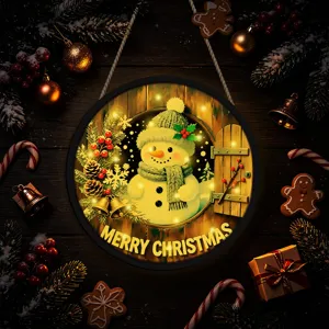 Close-up detail of the Christmas glowing round hanging plaque with snowman and LED light.