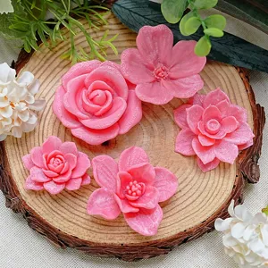 Close-up of vibrant pink 3D printed flower fridge magnets, featuring detailed petal textures.