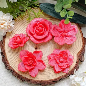 Detailed view of 3D printed magnetic flower fridge magnets in vibrant red floral designs.