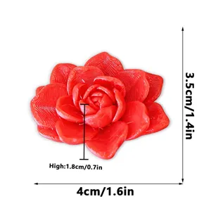 Detailed view of the 3D printed red flower fridge magnet, showing clear textures and size.