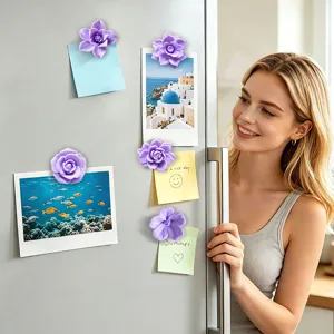 Detail view of 3D purple flower fridge magnets decorating a clean refrigerator surface.