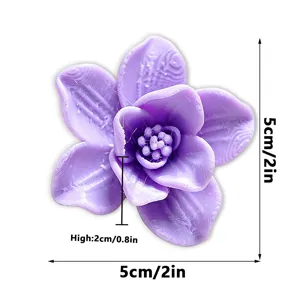 Detail shot of a 3D printed purple flower fridge magnet showing texture and dimensions.