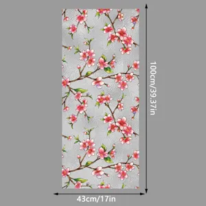 Vista detallada de la película estática para ventanas de cristal con flores de melocotón.
