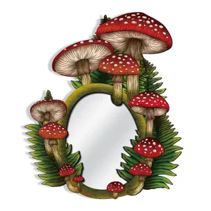 Close-up detail of bohemian wooden wall mirror featuring red mushroom and green fern decor.
