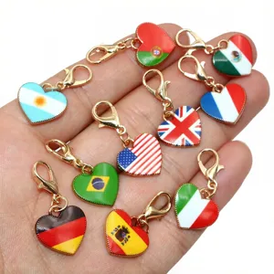 Detail shot of heart-shaped alloy national flag charms with lobster clasps for DIY jewelry.