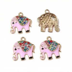 Close-up of pink enamel rhinestone elephant metal charms, DIY jewelry making craft supply.