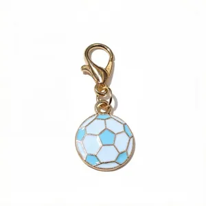 Close-up detail of the gold-tone alloy lobster clasp and blue-white enamel soccer charm.
