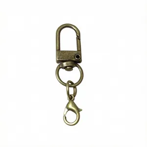 Porte-clés en métal bronze avec boucle en U et fermoir mousqueton, idéal pour les sacs.