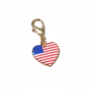 Close up view of the American flag heart charm pendant detail with lobster clasp for DIY jewelry.
