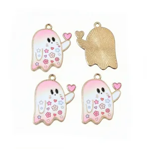Close-up detail of cute pink ghost enamel charms, alloy DIY jewelry making pendants.