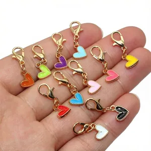 Colorful enamel heart charms with lobster clasps for DIY jewelry making and crafts.