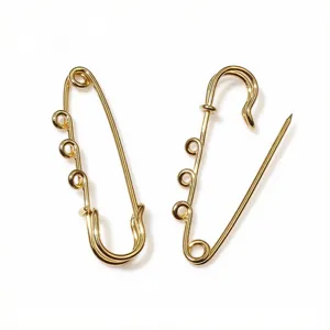 Gold stainless steel safety pin brooch with welded loops, detailed view of DIY jewelry findings.