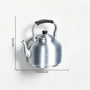 Detail view of a creative 3D retro kettle fridge magnet showing realistic silver finish.